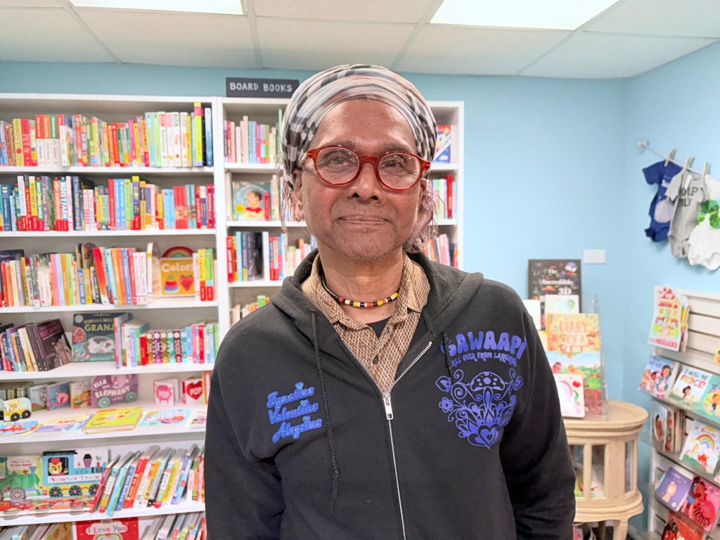 Ignatius posing for a picture at Roscoe Books.