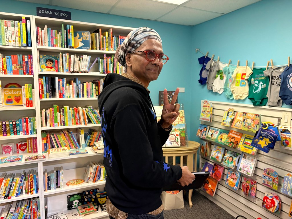 Ignatius doing a head turn and smiling.