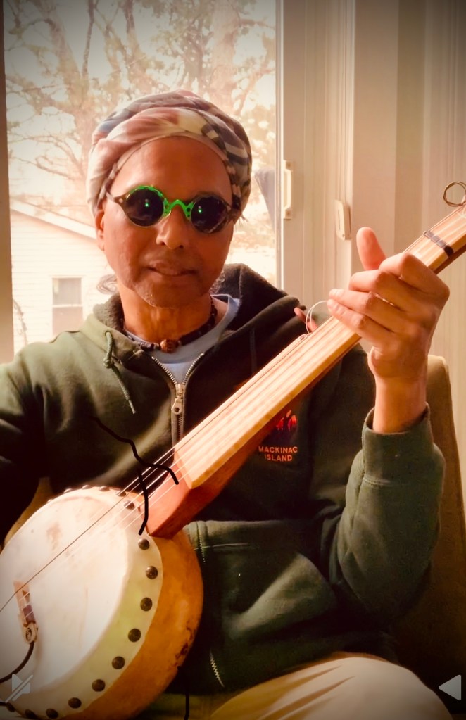 Ignatius playing the gourd banjo.